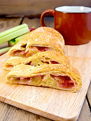 Image showing Strudel with rhubarb on wooden board