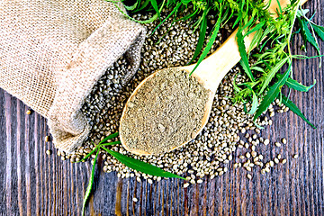 Image showing Flour hemp in spoon with bag on board top