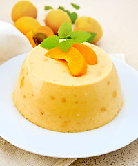 Image showing Panna cotta apricot with mint and fruits on napkin