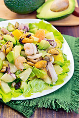 Image showing Salad with seafood and avocado in plate on board