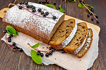 Image showing Fruitcake bird cherry cut on board