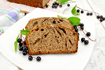 Image showing Fruitcake bird cherry in plate on board