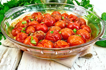 Image showing Tomatoes baked in glass pan on light board