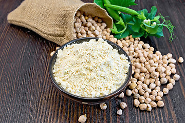 Image showing Flour chickpeas in bowl with peas on board