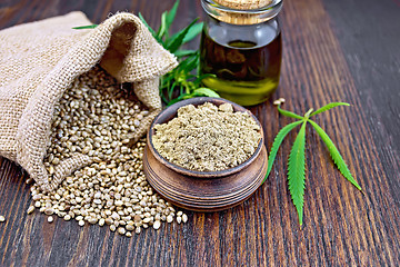 Image showing Flour hemp in bowl with bag and oil on board