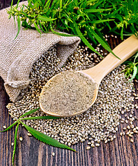 Image showing Flour hemp in spoon with leaf and bag on board