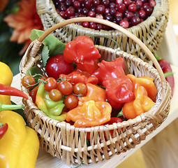 Image showing Wicker basket filled with fresh fruit and vegetables