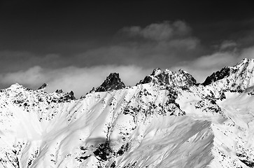 Image showing Black and white view on snowy mountains at sun day