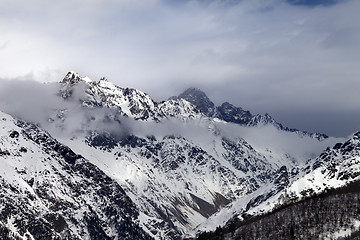 Image showing Sunlight mountains and gray cloudy sky