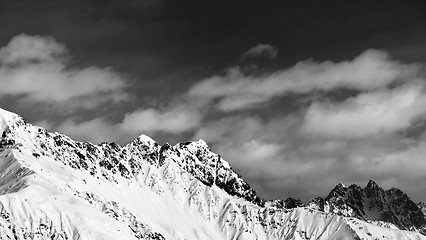 Image showing Black and white panoramic view on snow mountains at sun day