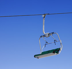 Image showing Chair-lift at ski resort and blue clear sky