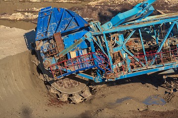 Image showing Long conveyor belt transporting ore