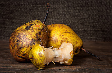 Image showing Two pears and stub on wooden table