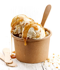Image showing ice cream with caramel sauce and ground nuts
