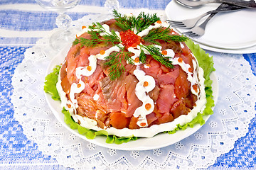 Image showing Salad with salmon in plate on blue tablecloth