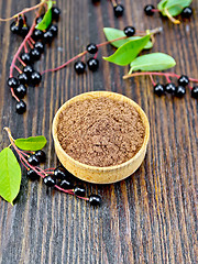 Image showing Flour bird cherry in bowl on dark board