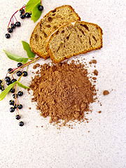 Image showing Flour bird cherry with fruitcake on table