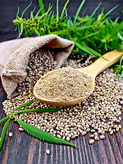 Image showing Flour hemp in spoon with leaf on board