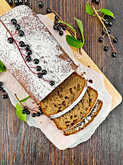 Image showing Fruitcake bird cherry cut on board top