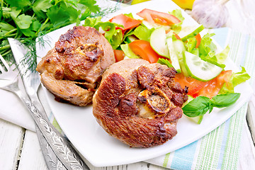 Image showing Turkey steak roasted with vegetables on table