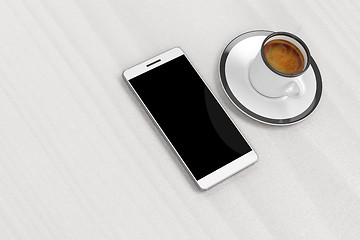 Image showing Smartphone and coffee cup