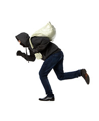 Image showing Thief runs with gray bag