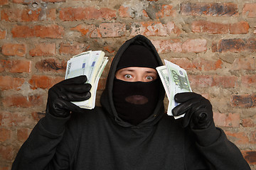 Image showing Burglar in standing black gloves