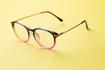 Image showing Blue and pink rim of glasses