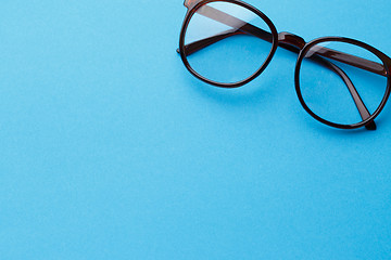 Image showing Brown-rim eyeglasses in empty background