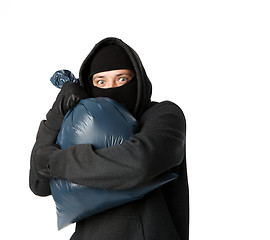 Image showing Terrible mugger holding large bag