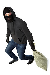 Image showing Thief in mask carries bag