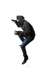 Image showing Prowling thief in black mask