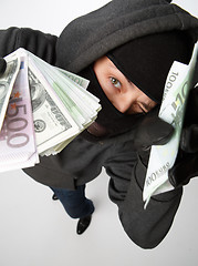 Image showing Burglar in mask with money