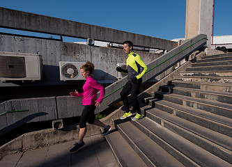 Image showing young  couple jogging on steps