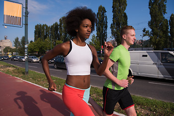 Image showing multiethnic group of people on the jogging