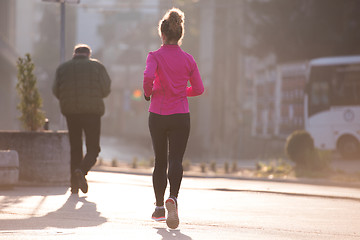 Image showing sporty woman jogging on morning