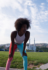 Image showing Portrait of sporty young african american woman running outdoors