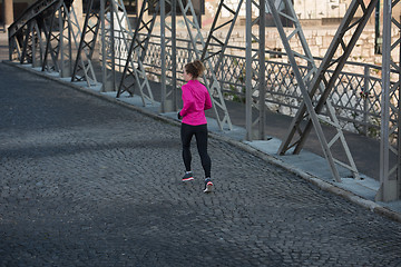 Image showing sporty woman jogging on morning