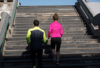 Image showing young  couple jogging on steps