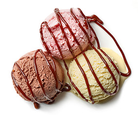 Image showing various ice cream balls with chocolate sauce