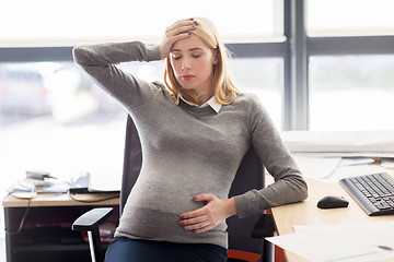 Image showing pregnant businesswoman feeling sick at office work