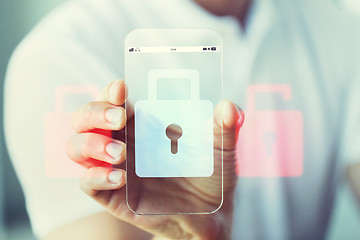 Image showing close up of hand with security lock on smartphone