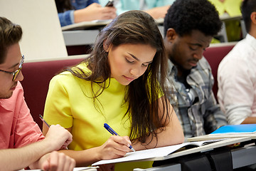 Image showing group of international students writing at lecture