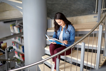 Image showing high school student girl reading book at library