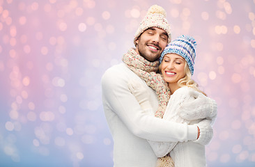 Image showing smiling couple in winter clothes hugging