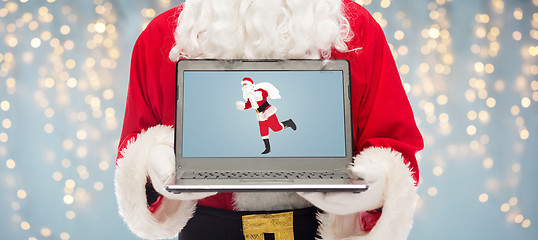 Image showing close up of santa claus with laptop