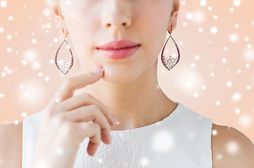 Image showing close up of beautiful woman face with earrings