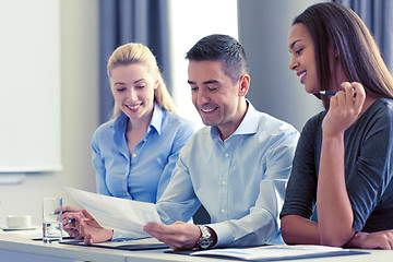 Image showing business people with papers meeting in office