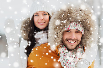 Image showing happy couple having fun over winter background