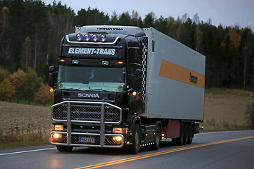 Image showing Black Scania Reefer Truck on the Road at Night